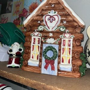 Festive Ceramic Gingerbread House with Santa Figurine